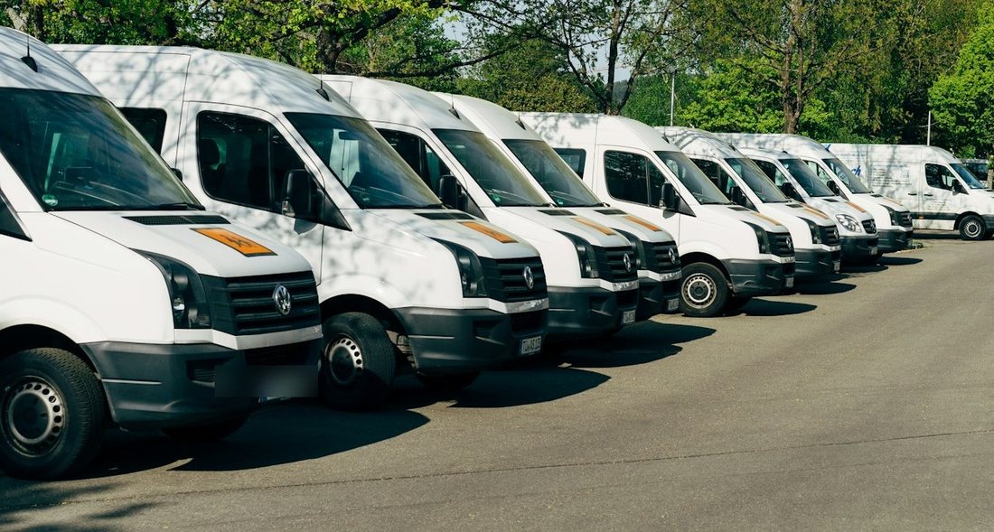 Fleet of white commercial vans